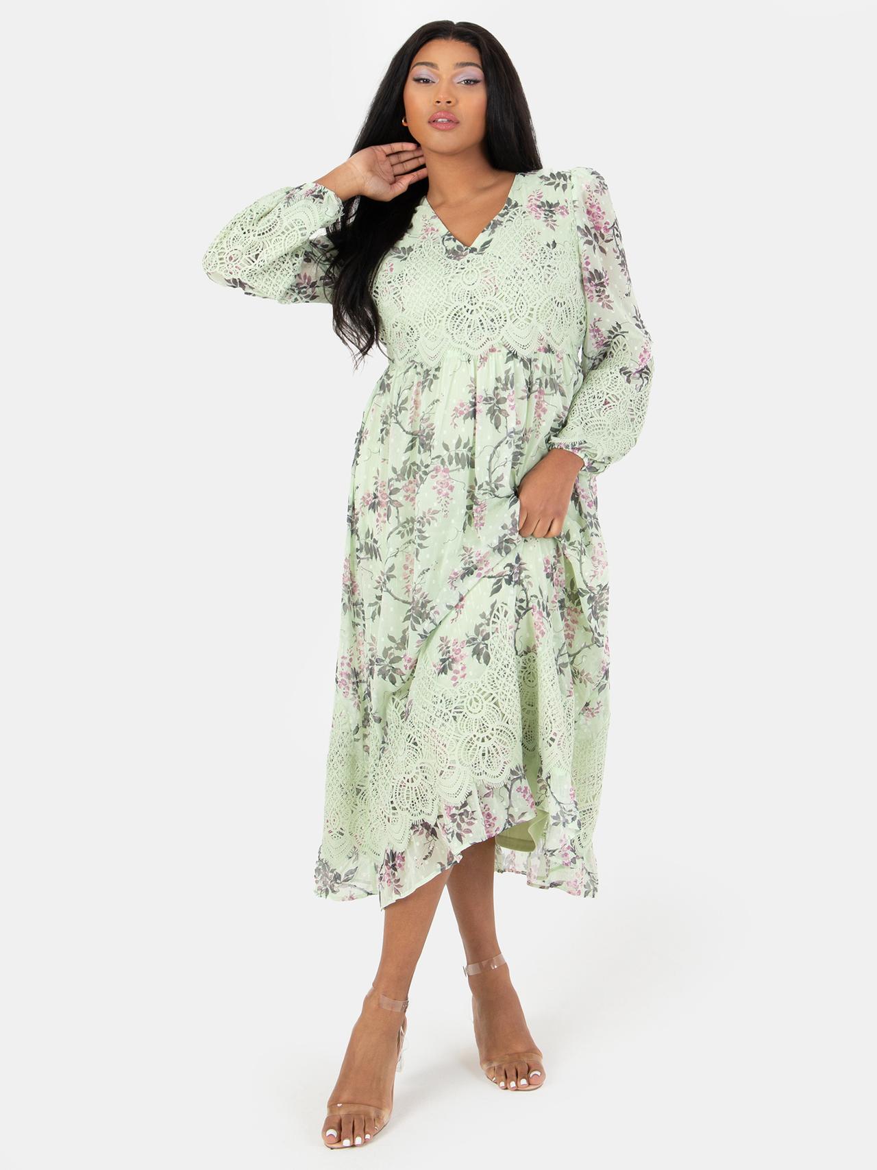 Model wearing a lace green floral bridesmaid dress