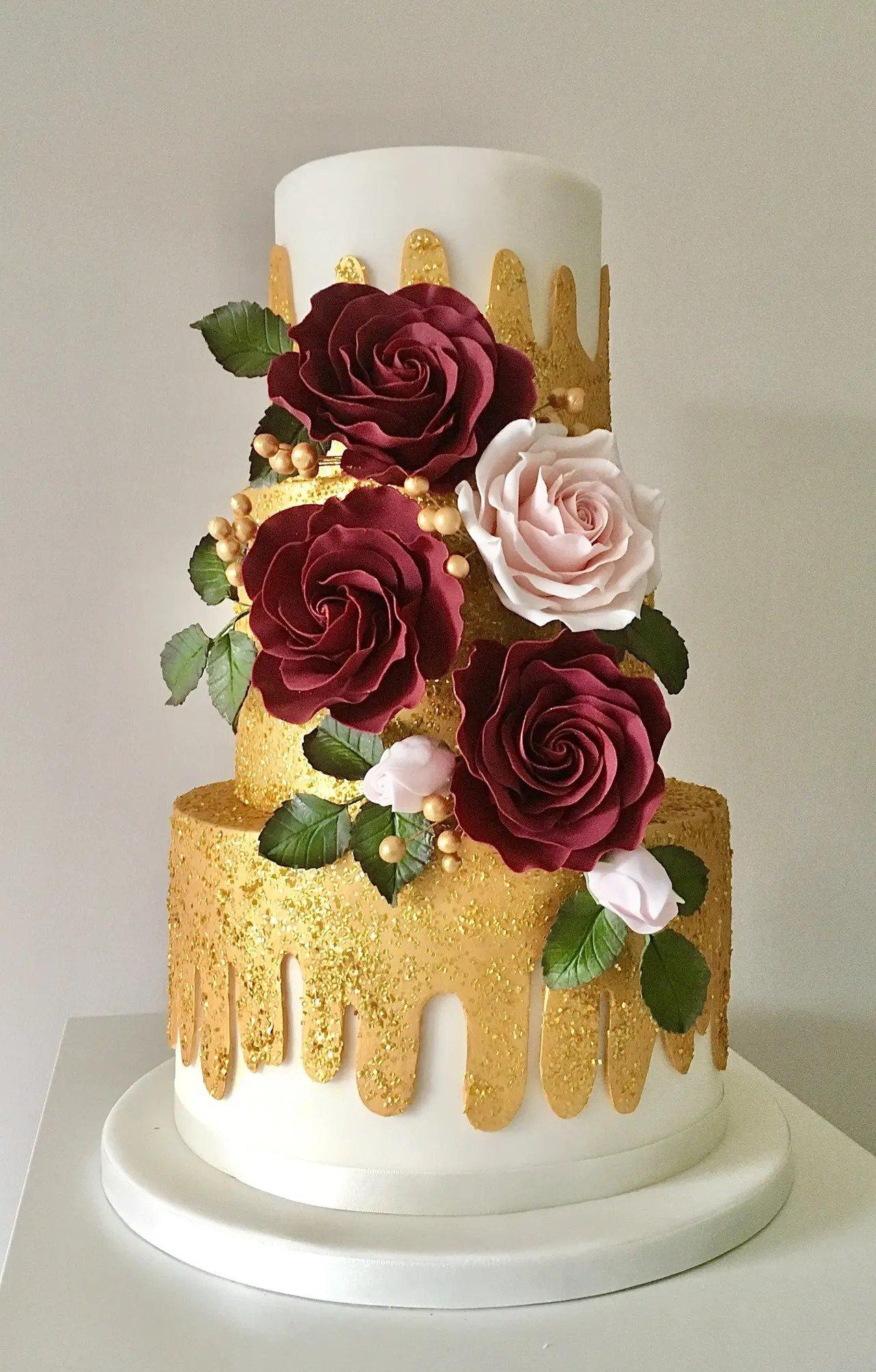 gold drip wedding cake with sparkly glitter