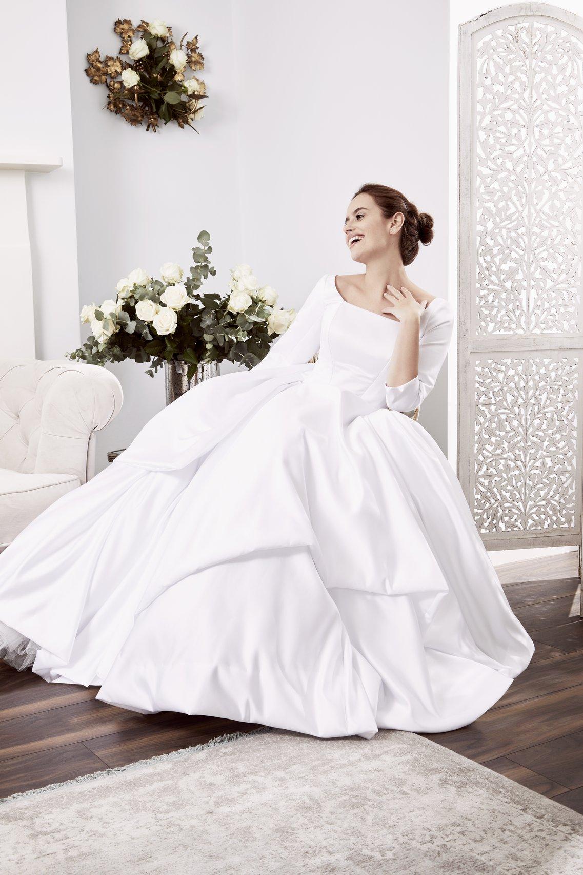 made to order simple wedding dress with long sleeves and voluminous skirt