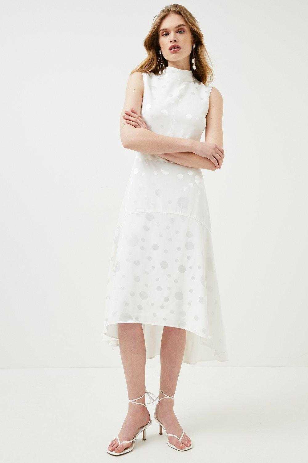 Model wearing a high neck polka dot print casual wedding dress