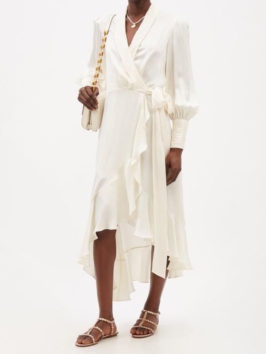 A model wearing a wrap-over silk satin dress