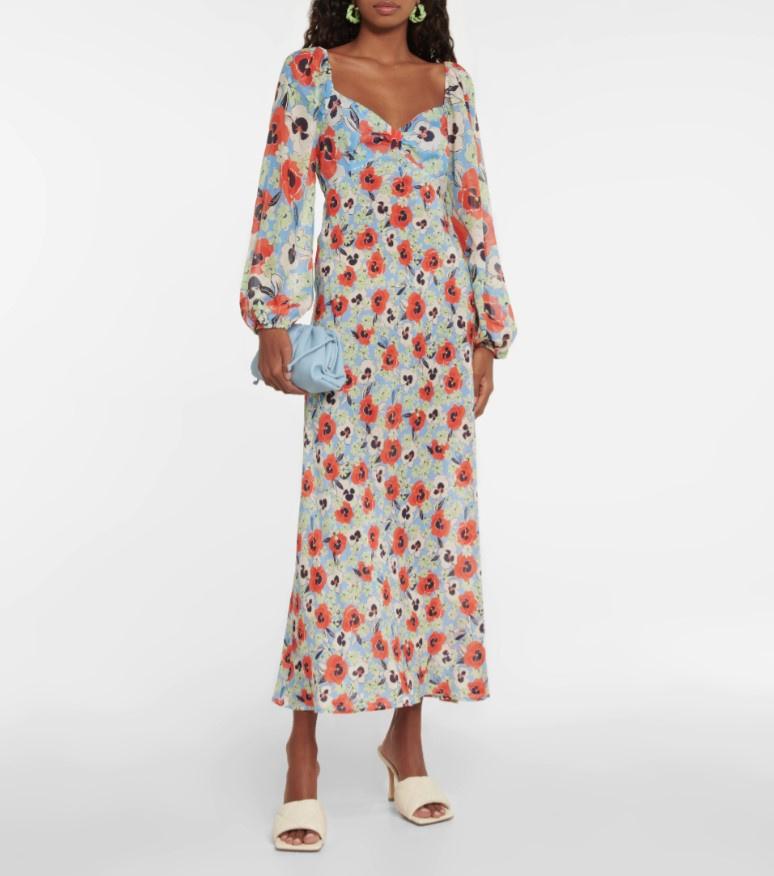 Model wearing silk calf-length dress with red poppy patter, balloon sleeves, and sweetheart neckline