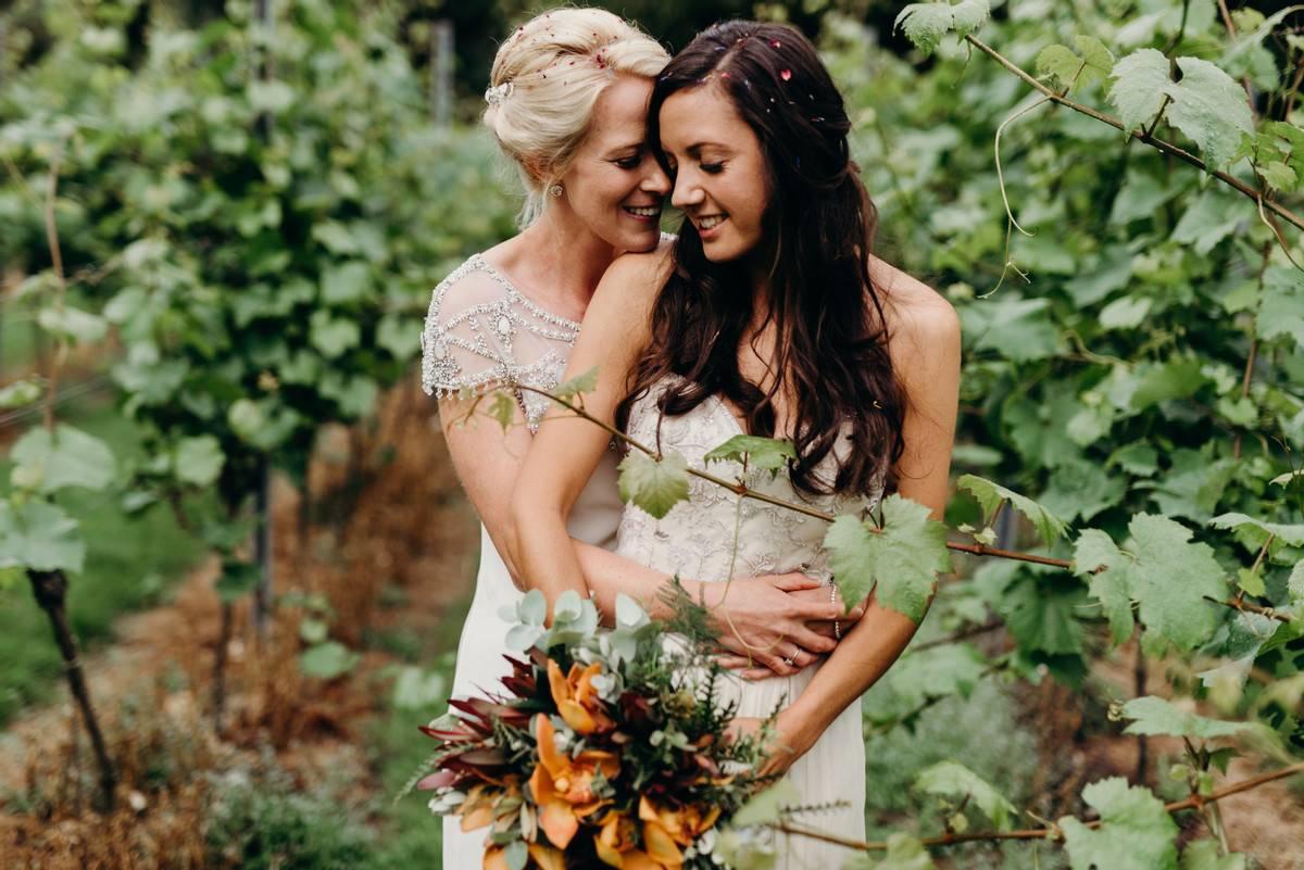 Bride and bride in a woodland