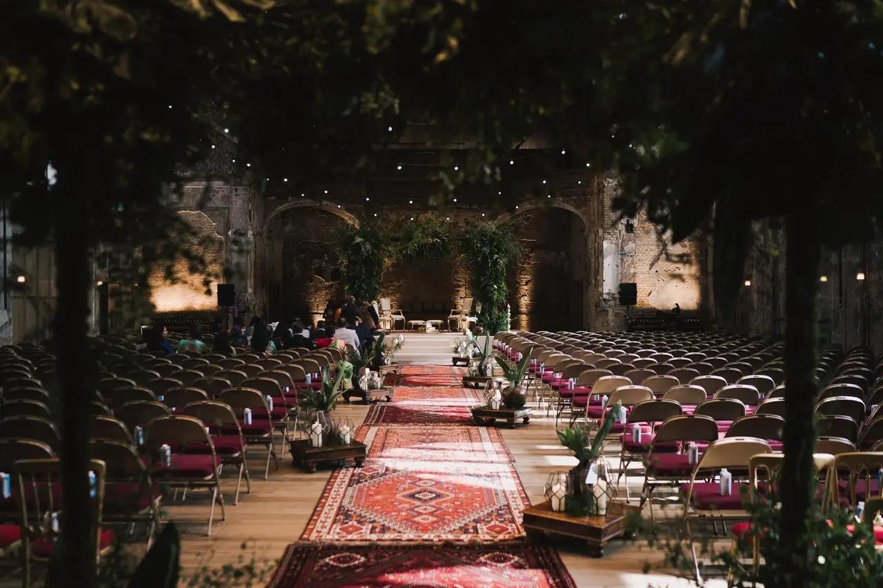 A rustic Victorian hall set up for a large wedding ceremony