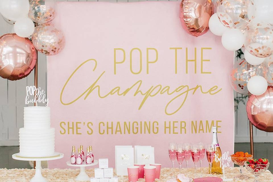 Pop the Champagne bridal shower backdrop with balloons