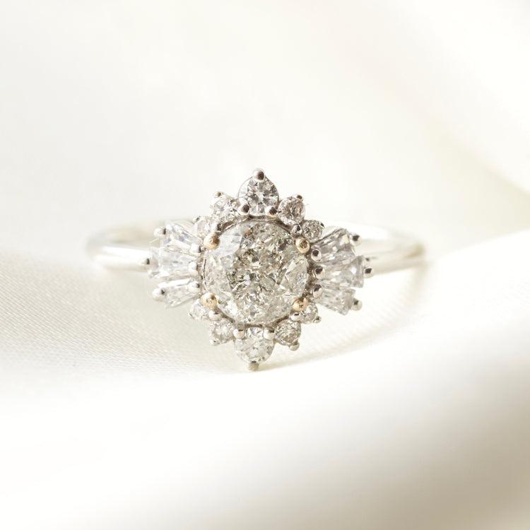 Salt and pepper circle gem in a halo of white diamonds with solid white gold