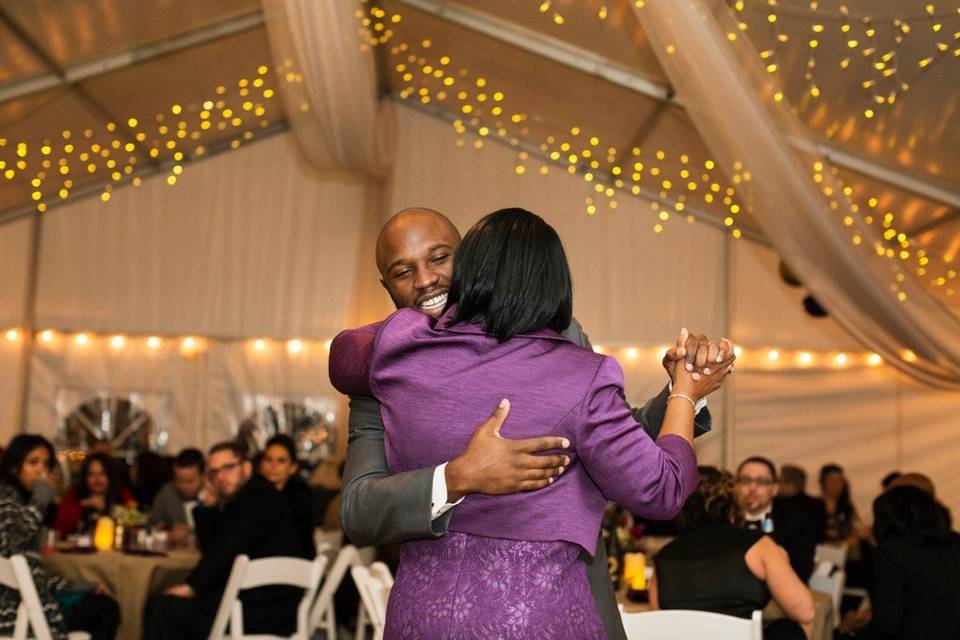 Mother and son dancing together at a wedding