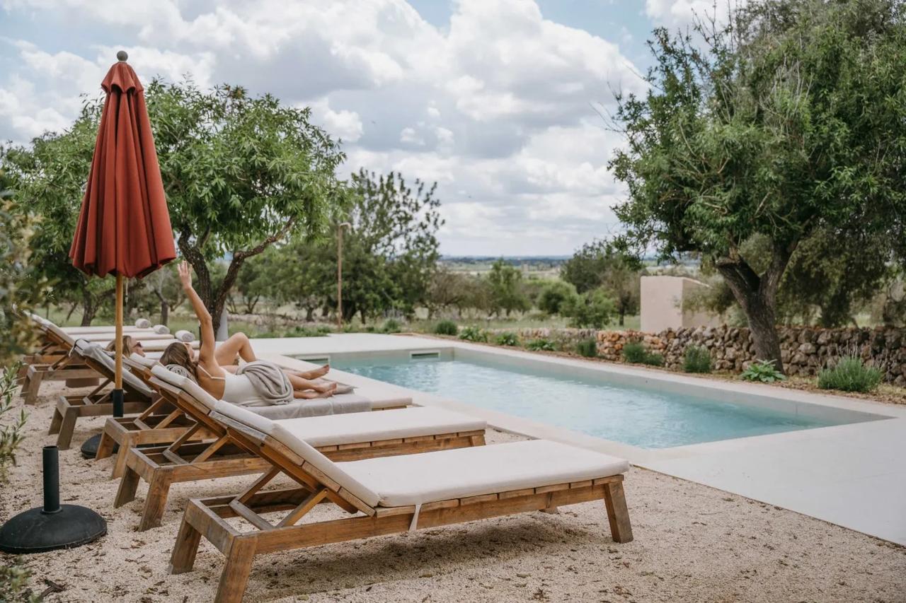 a guest sunbathing by the pool at The Lodge hotel in Palma de Mallorca