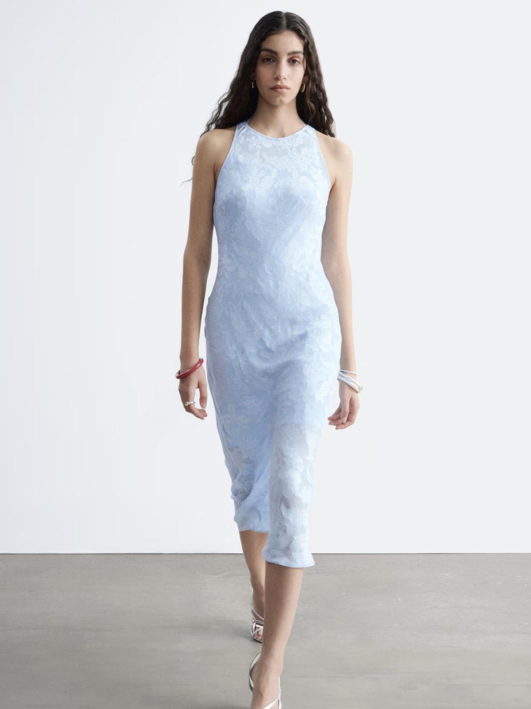 model walking in midi length pale blue silk viscose dress