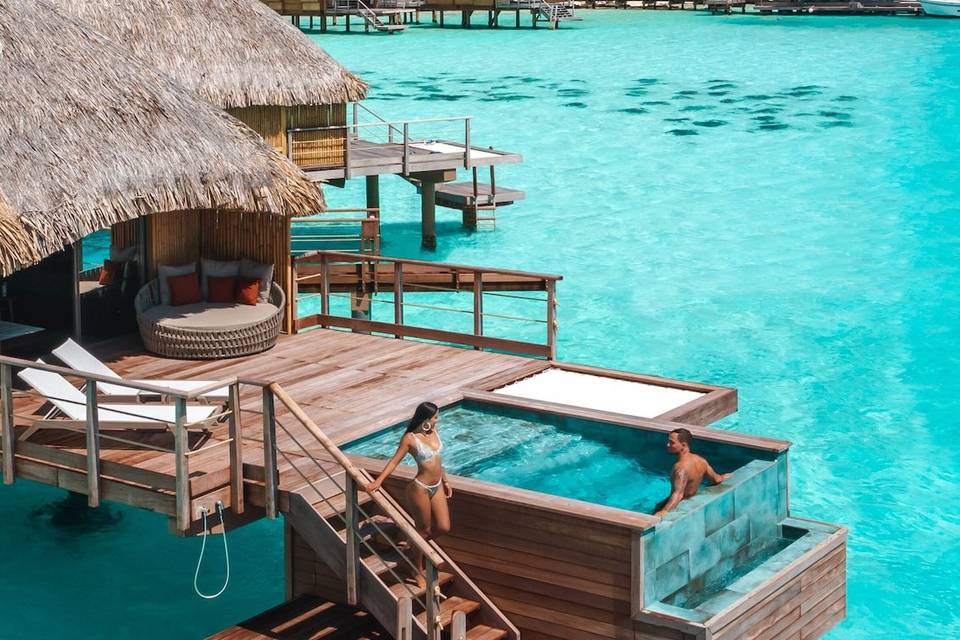 A couple enjoying a luxury hotel on honeymoon in Bora Bora