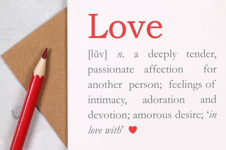 Wedding anniversary card with the definition of love written on it