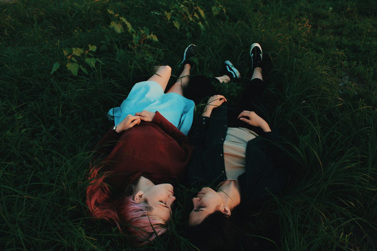 couple lying outside stargazing at night