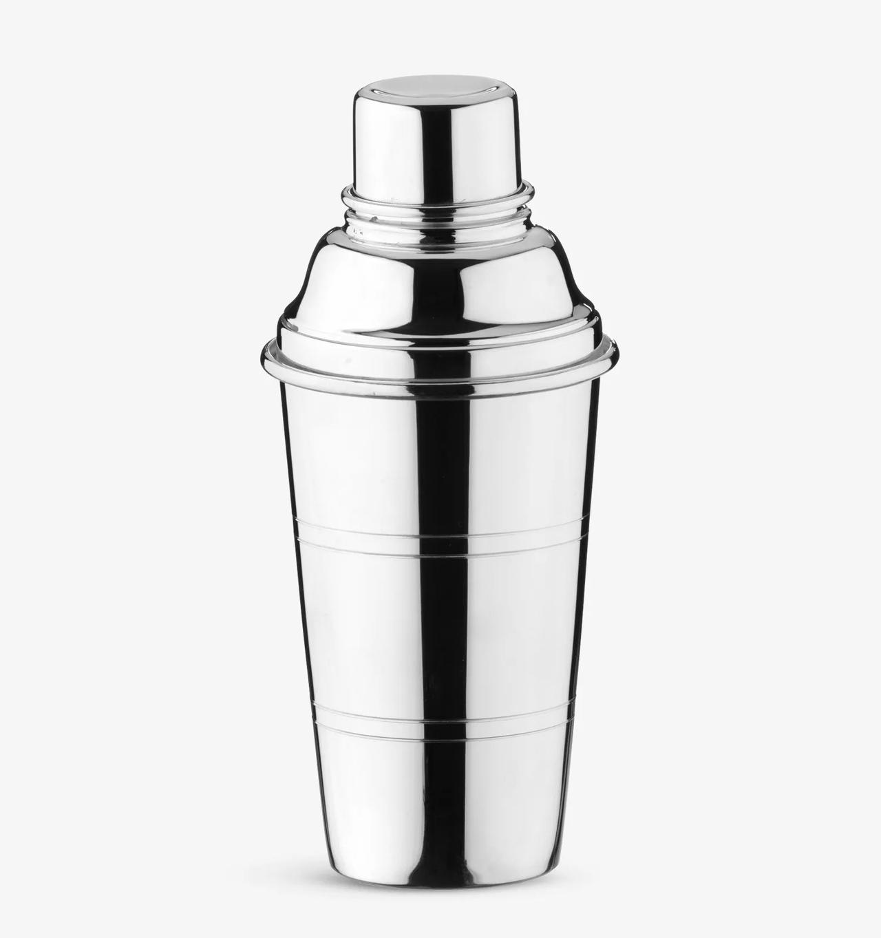 Image of a silver plated cocktail shaker on a white background.