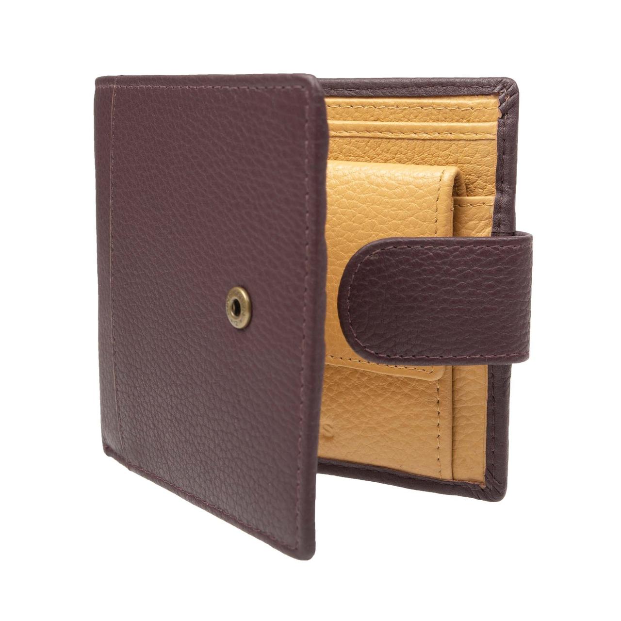 An open brown leather wallet with lighter-coloured twill fabric lining.