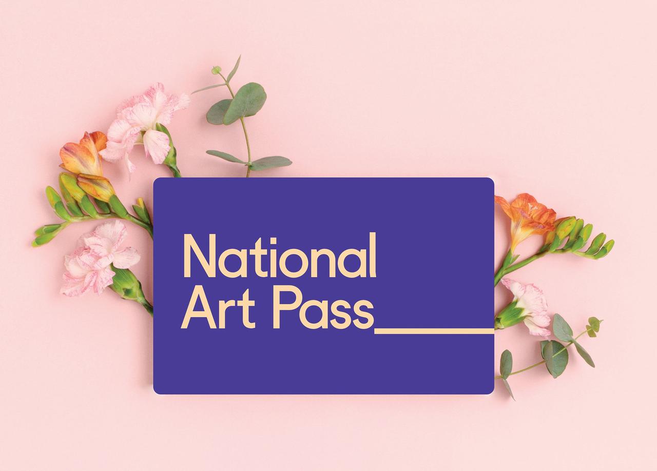 A national art pass on a pink background pictured with some pink buds.