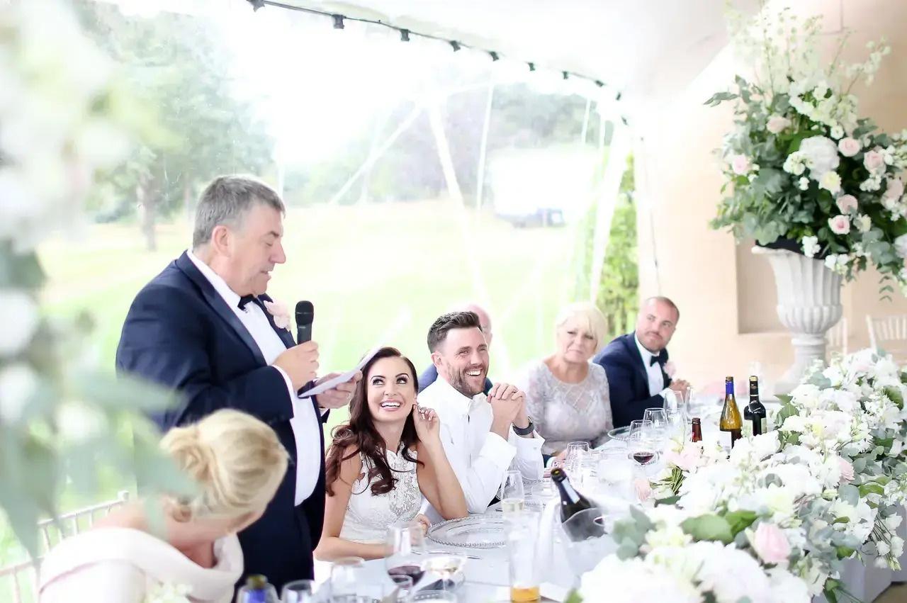 man giving speech at wedding