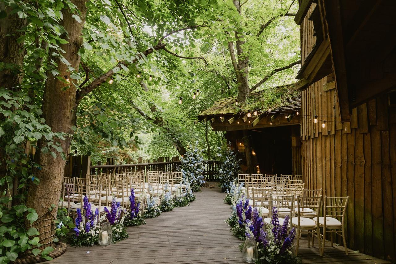 A ceremony space outdoors on a treehouse platform 