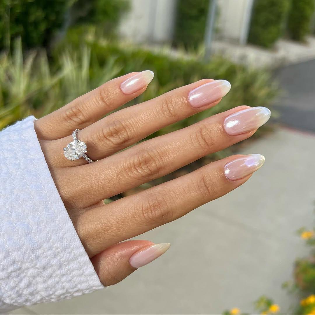 Bridal manicure with nude shiny chrome nails 
