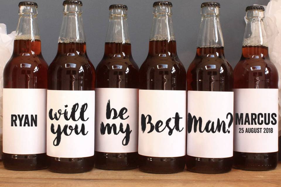 six bottles of beer with special labels as a best man proposal