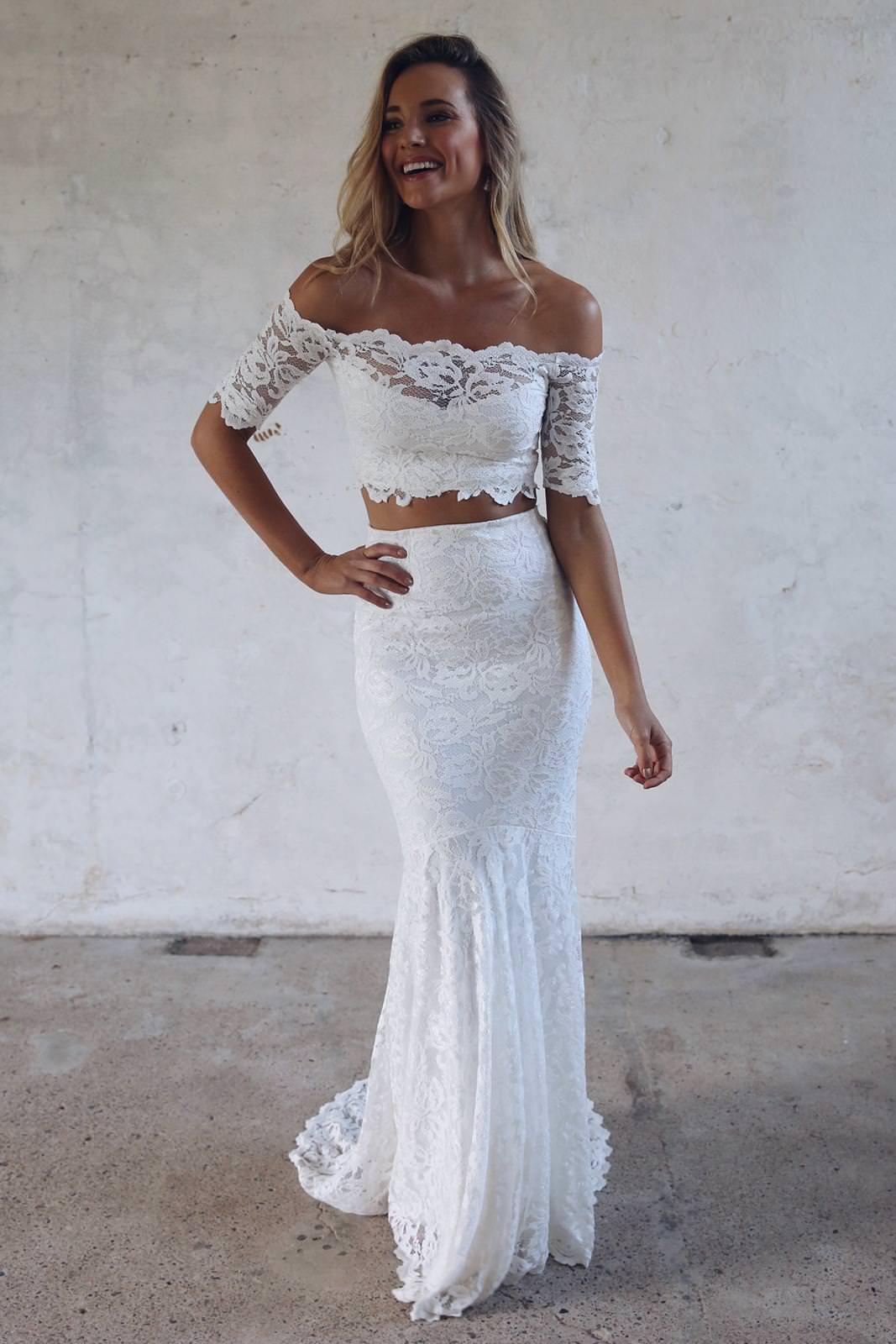 Image of a model wearing a two-piece lace wedding dress