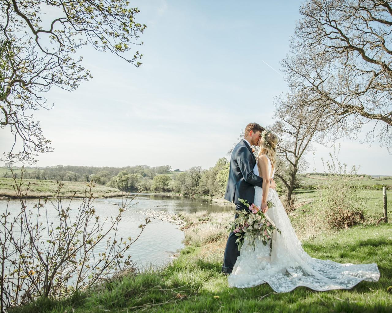 Bride and groom kissing at Lancashire wedding venue Hobbit Hill