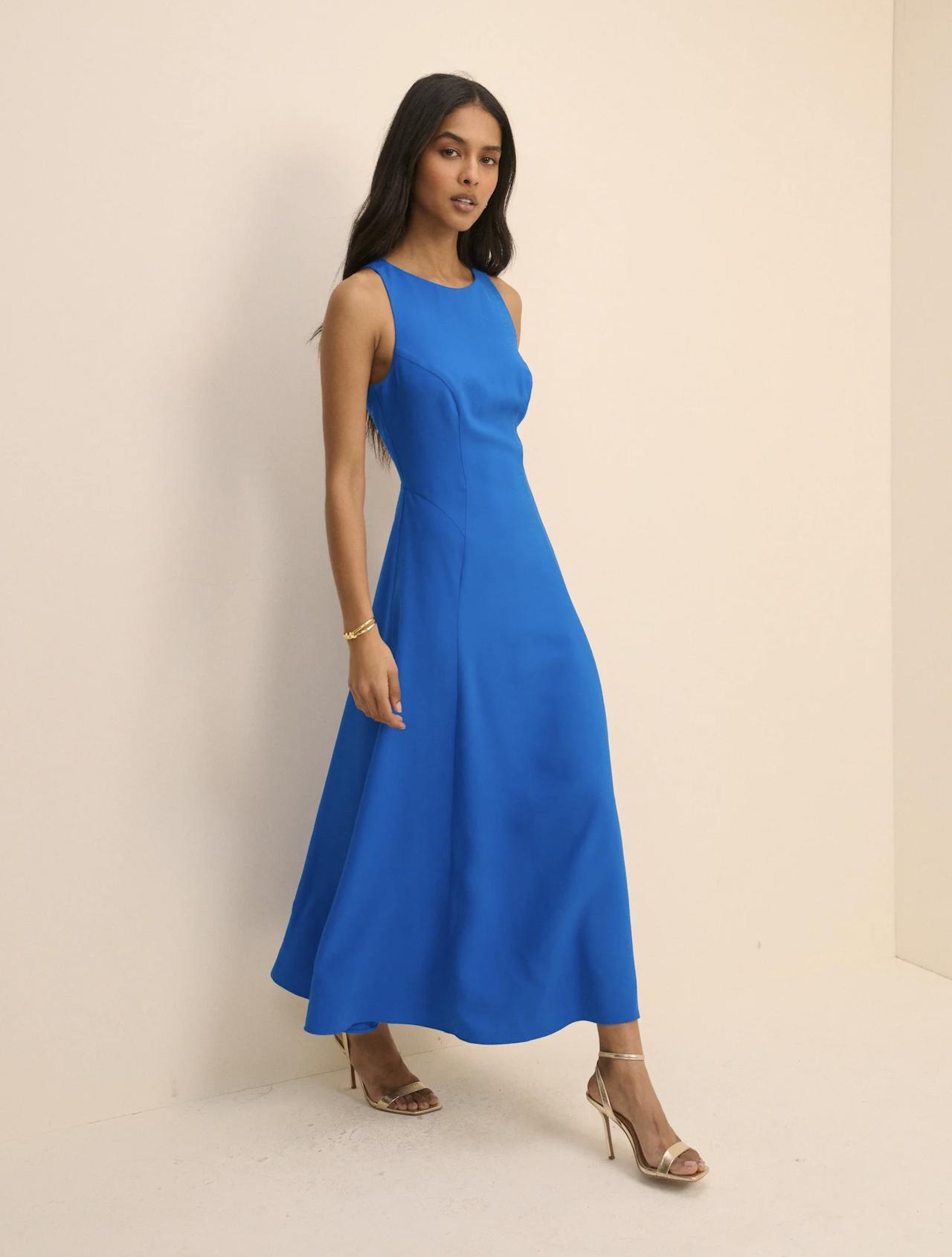 model walking in a cobalt blue midi dress from Nobody's Child
