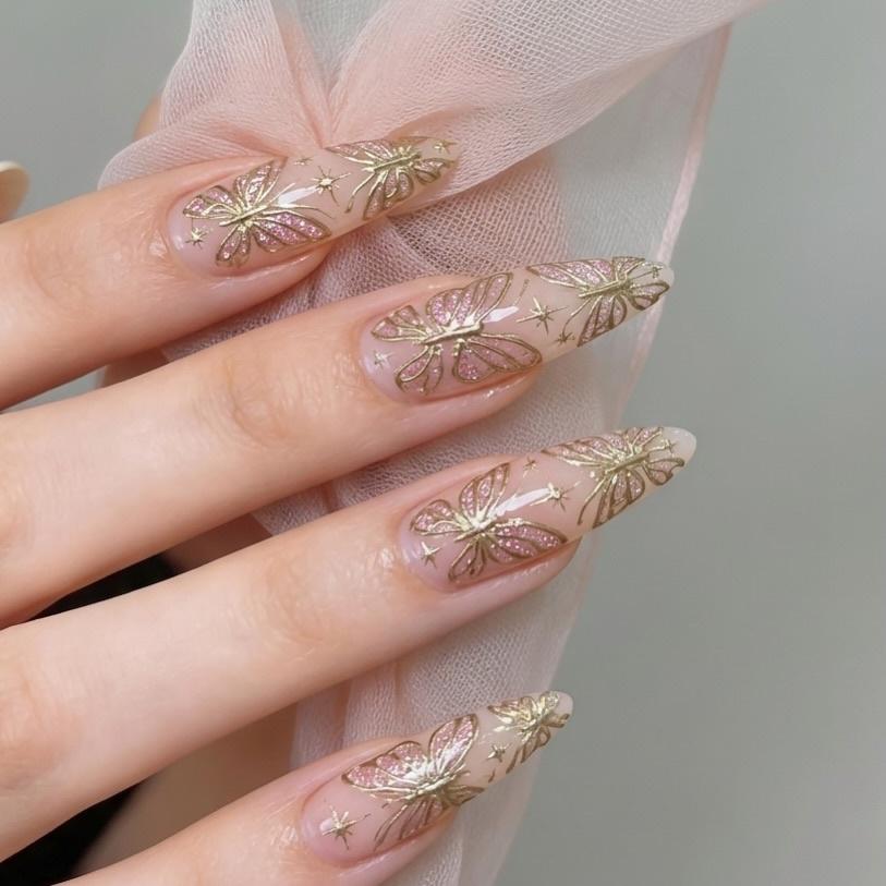 Sparkly gold butterflies nail art