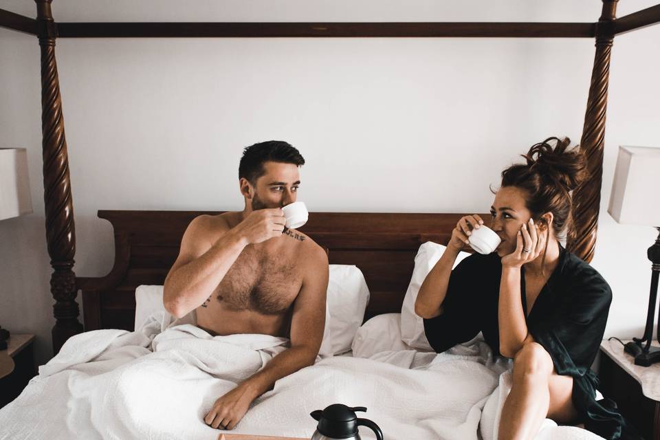 Couple having a breakfast in bed honeymoon experience