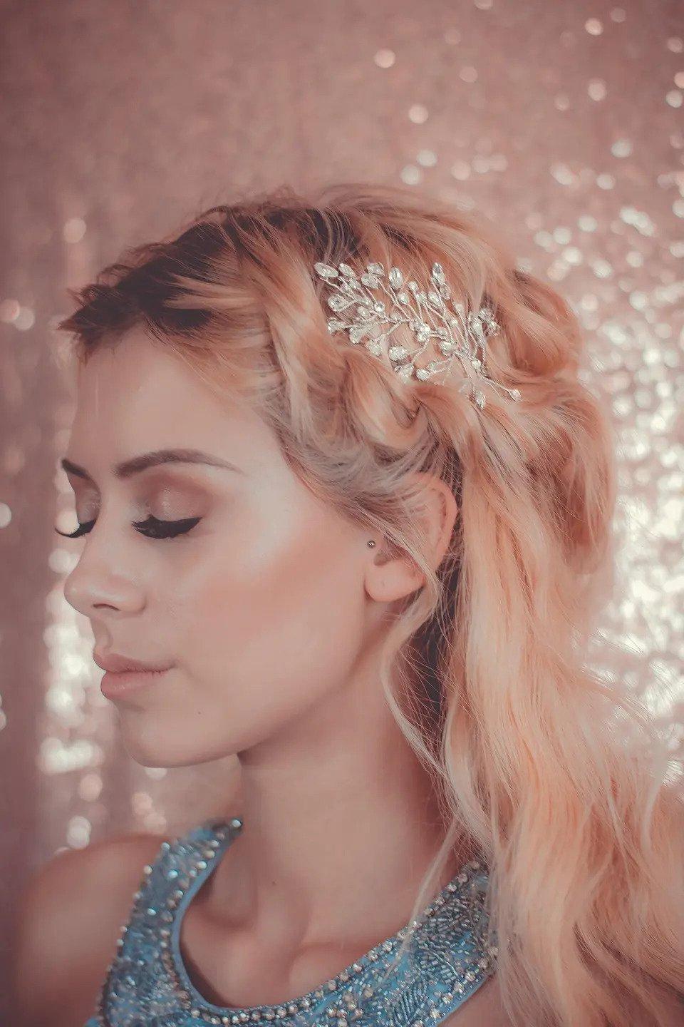 Bride with pink hair, plait tied at side and decorate with a silver leaf accessory