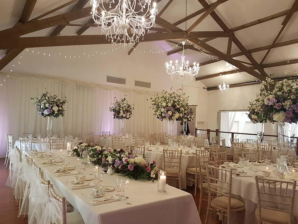 Interior of oak-beamed barn at Northamptonshire wedding venue Brampton Grange Estates