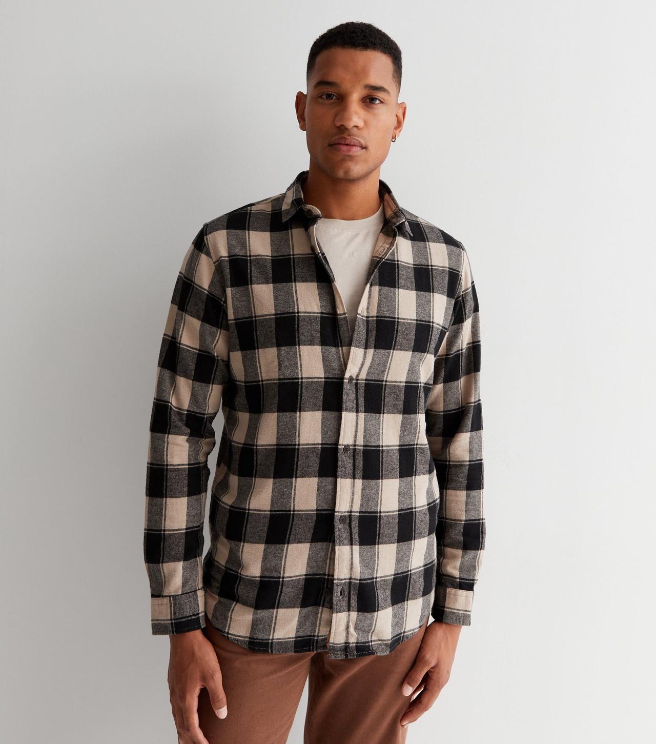 Model wearing a check overshirt