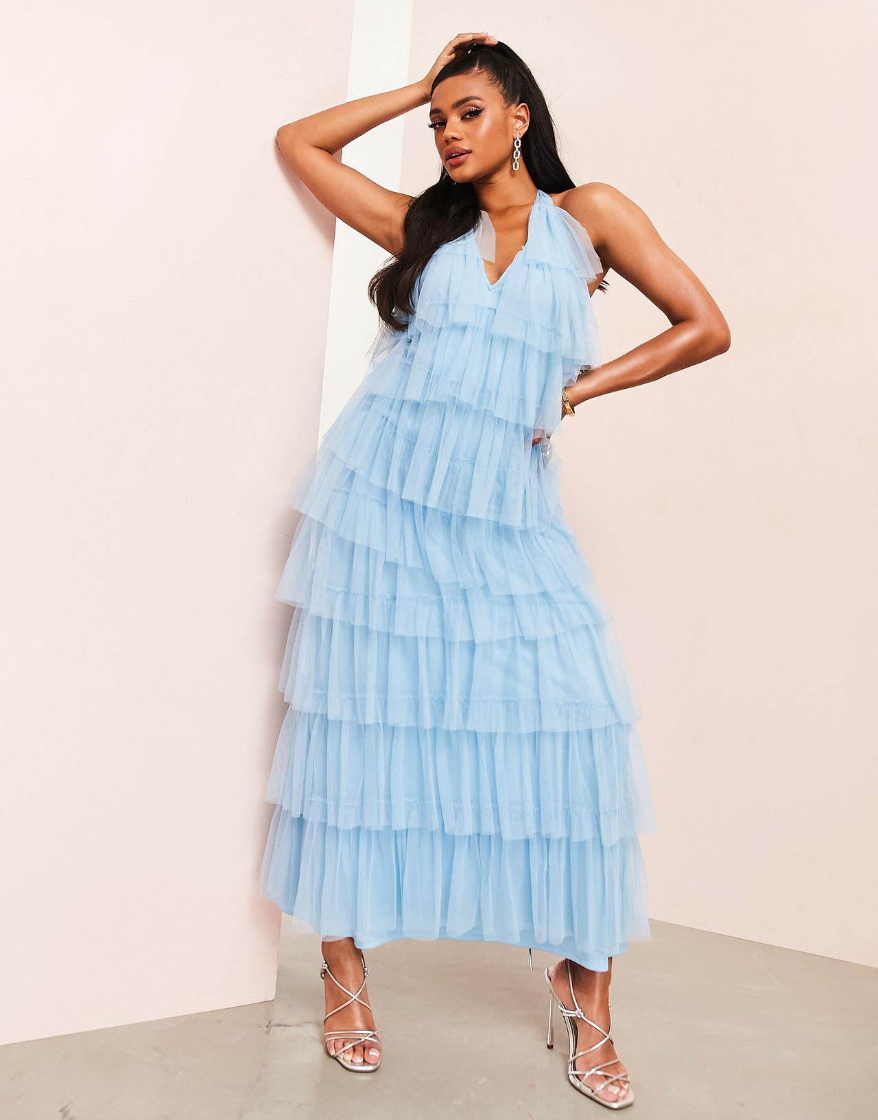 Model wearing a tulle blue wedding dress