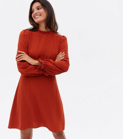 Rust-coloured mini dress with long sleeves and ruched neckline