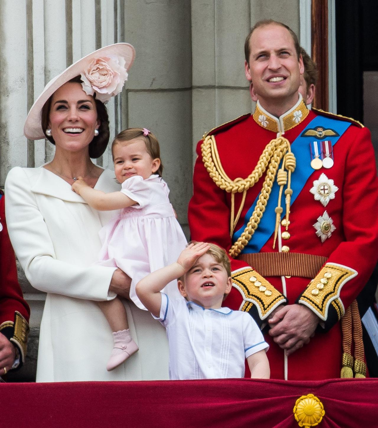 Kate Middleton, Prince William, George and Charlotte laugh on a balcony