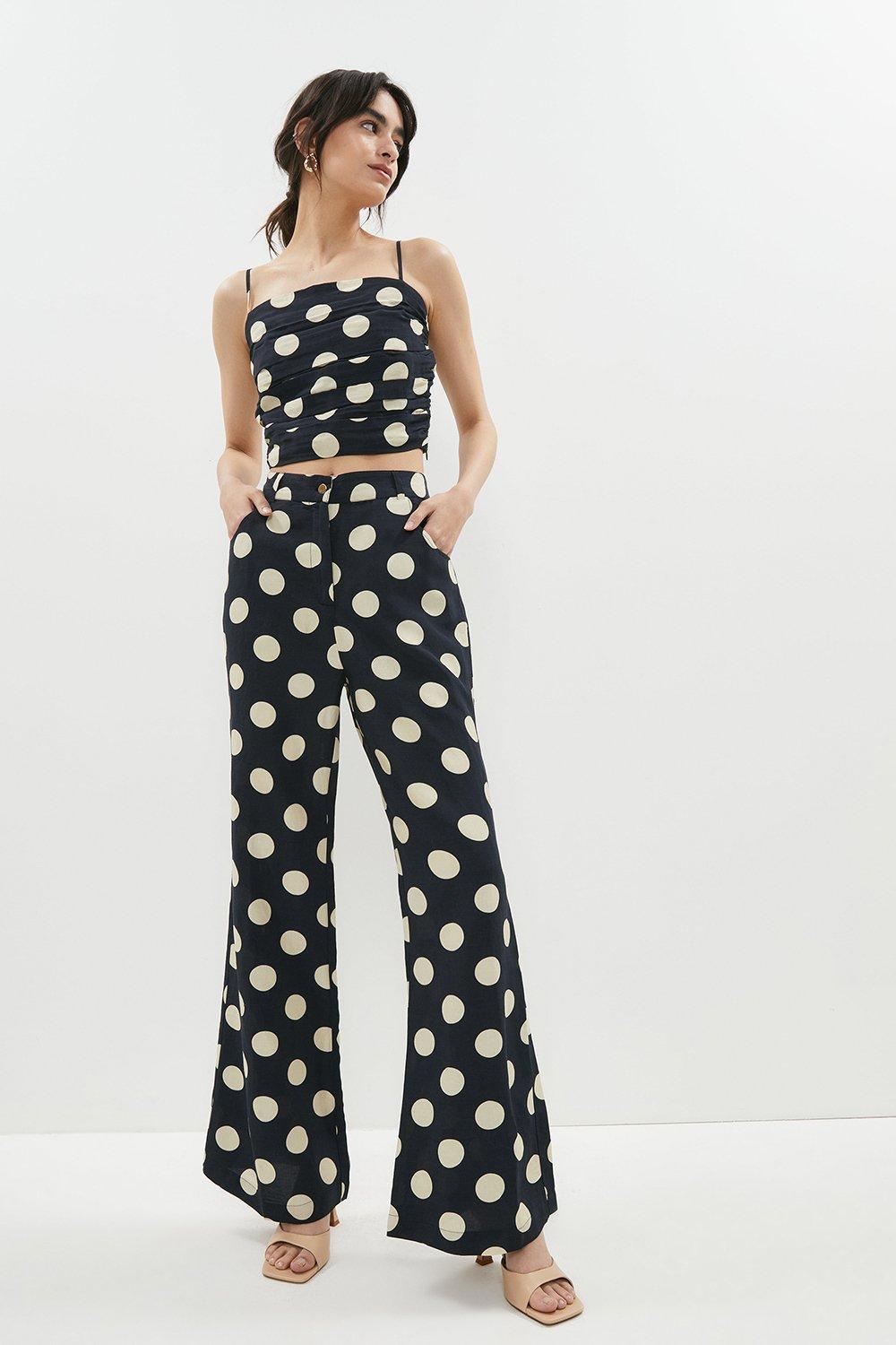 Model wearing a polka dot black and white linen co-ord