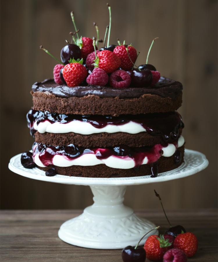 Black forest rustic wedding cake topped with cherries