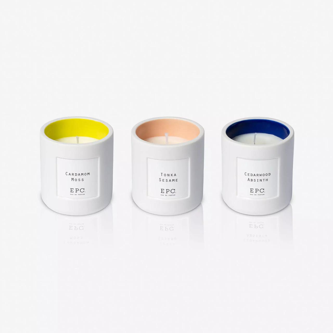 Trio of candles in yellow, pink and blue