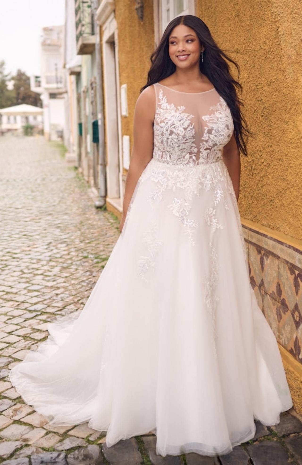 Plus size bride in illusion neckline wedding dress