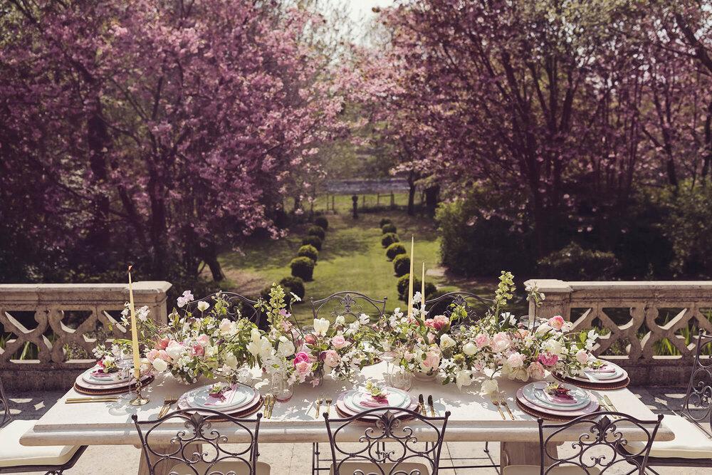 Wedding reception table in the garden of Lancashire wedding venue Casterton Grange