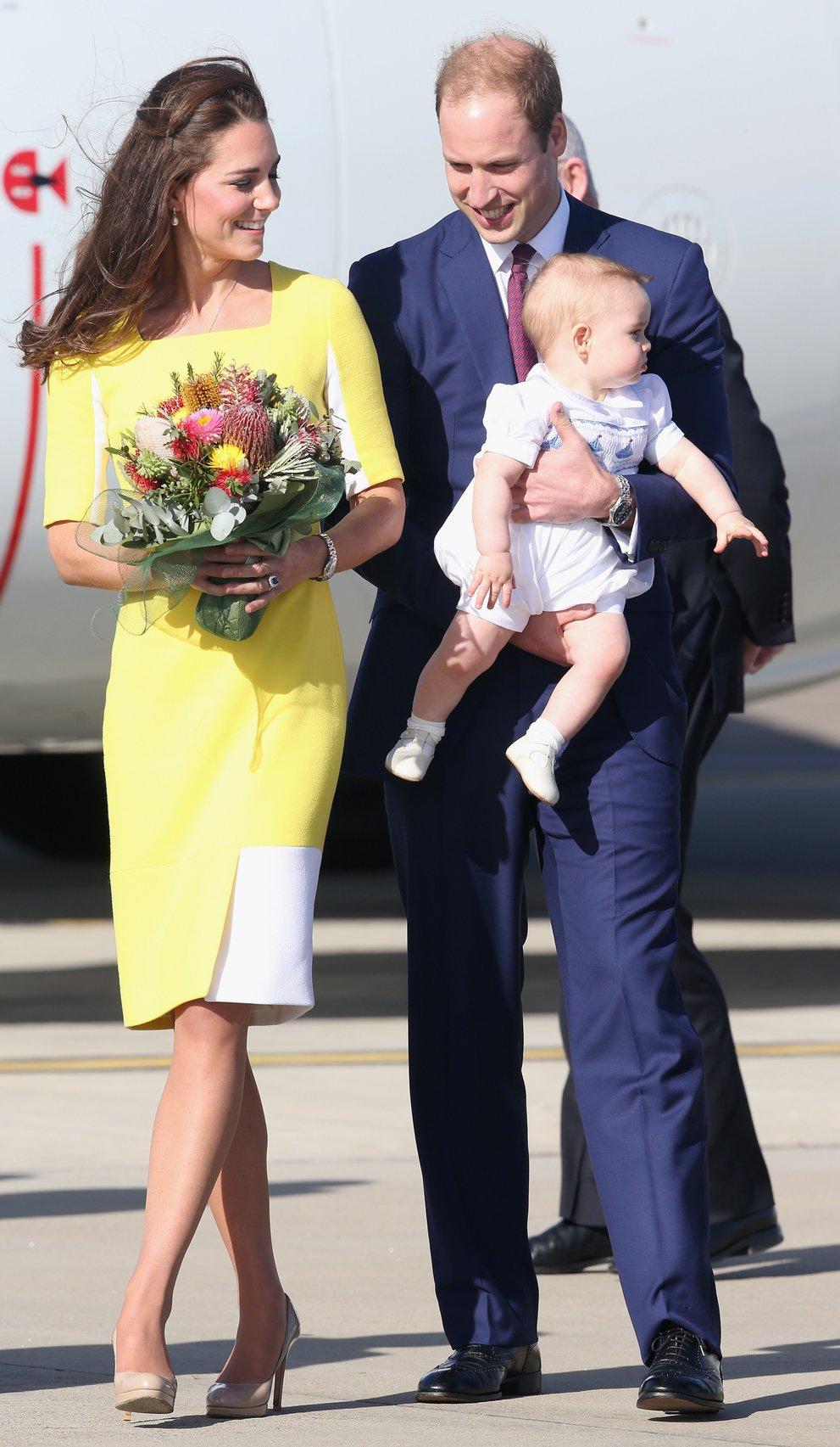 Kate Middleton and Prince William hold a baby George