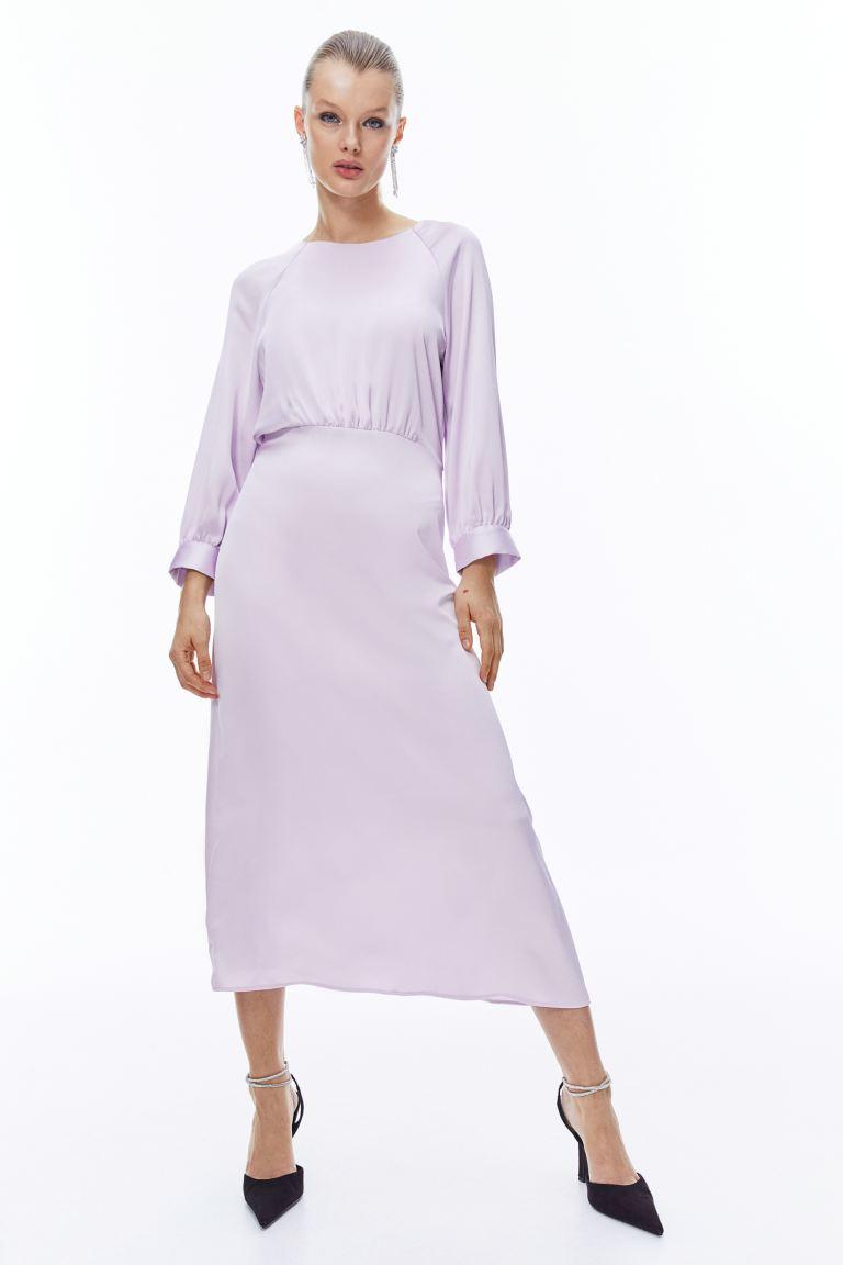 Model wearing a lilac dress