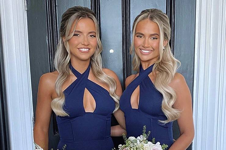 Molly-Mae and her sister wearing halter neck navy bridesmaid dresses