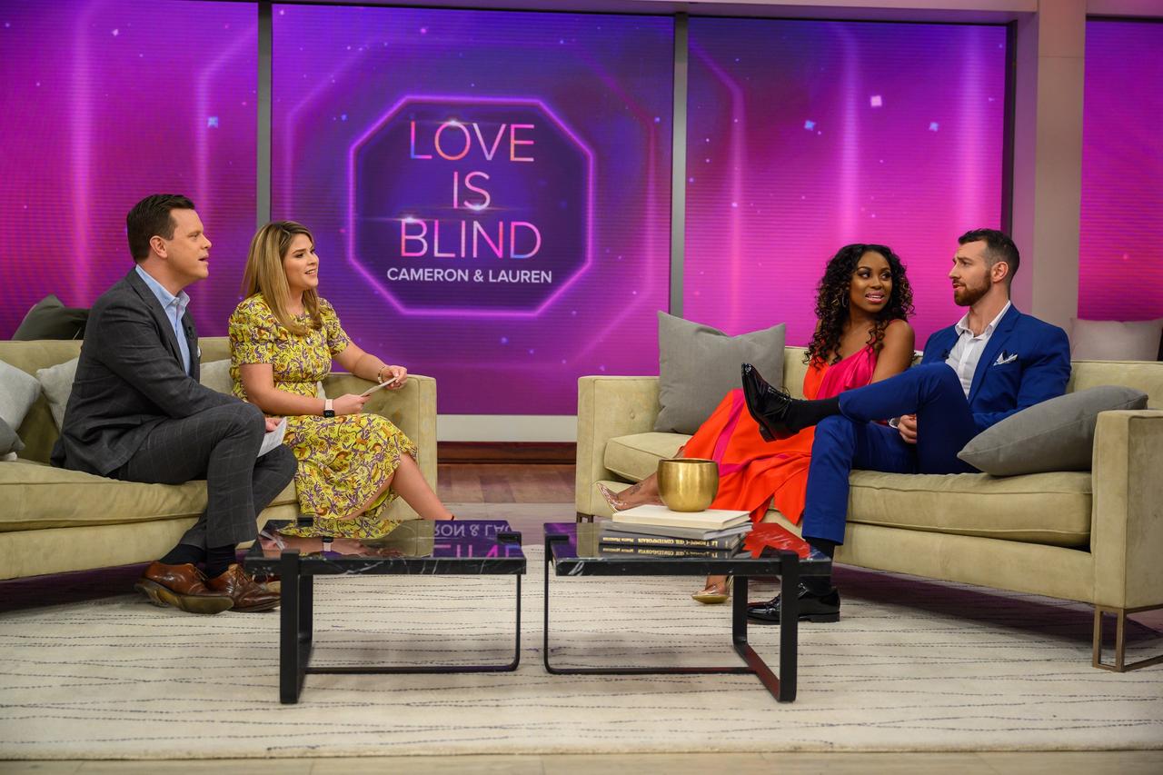 lauren and cameron from love is blind sitting on a sofa being interviewed on a tv show