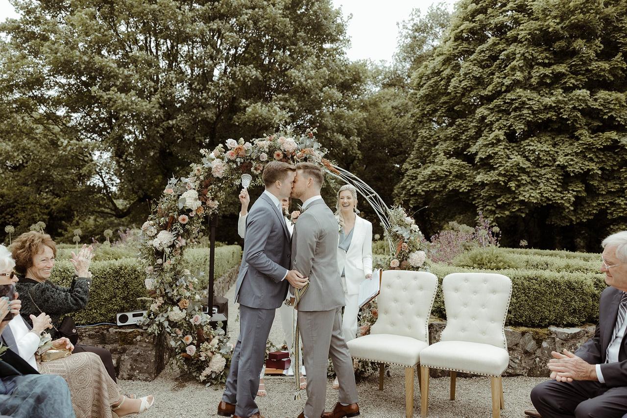 The grooms' kiss at the altar