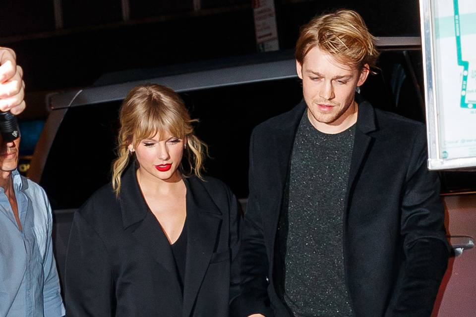 Joe Alwyn and Taylor swift leaving an event together