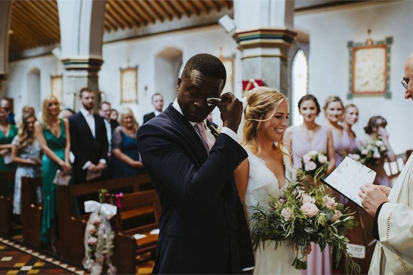 Bride and groom shed a tear at their wedding ceremony when a wedding poem is spoken