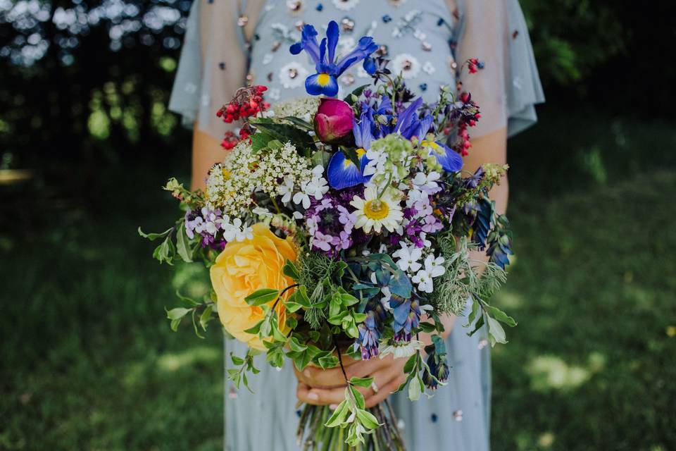 Bride holding a bright wedding bouquet