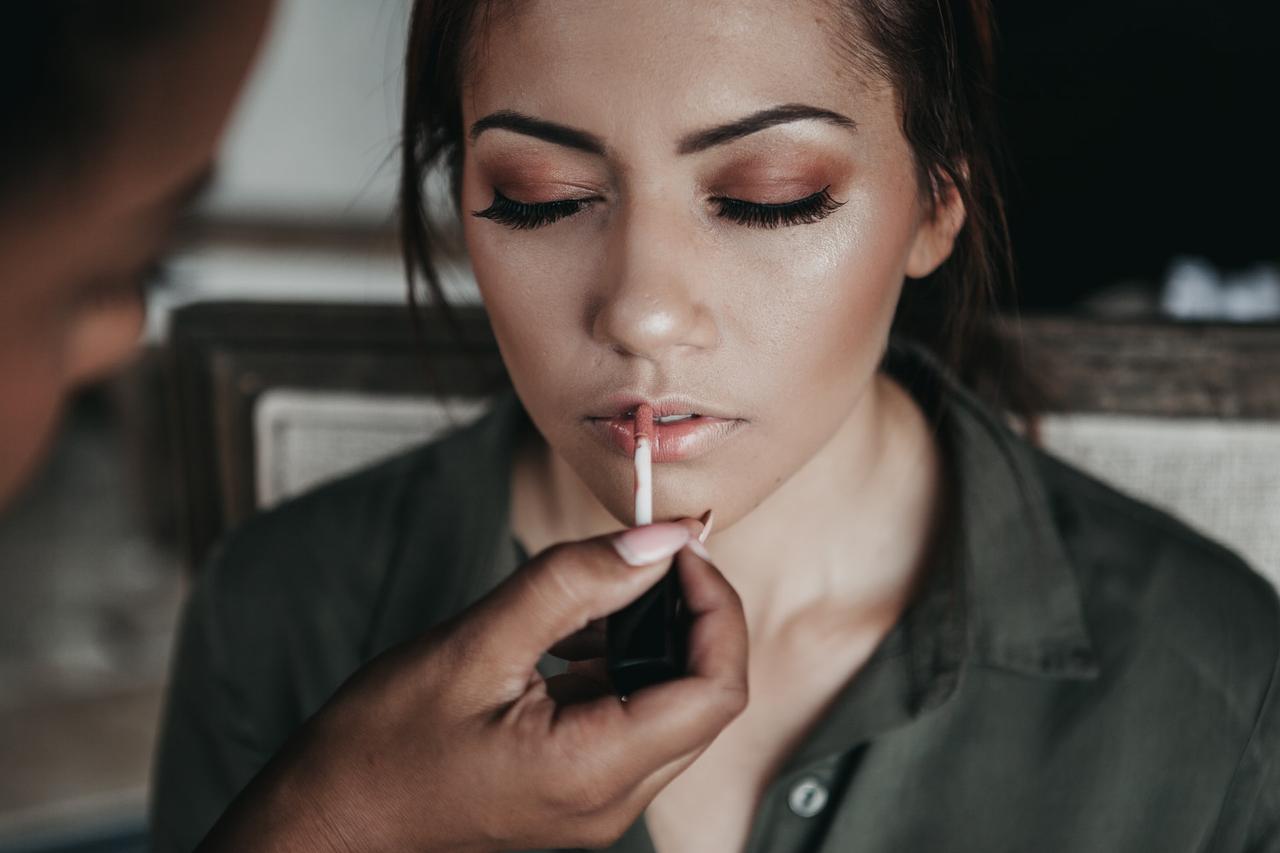 Bride having her wedding makeup applied by a makeup artist