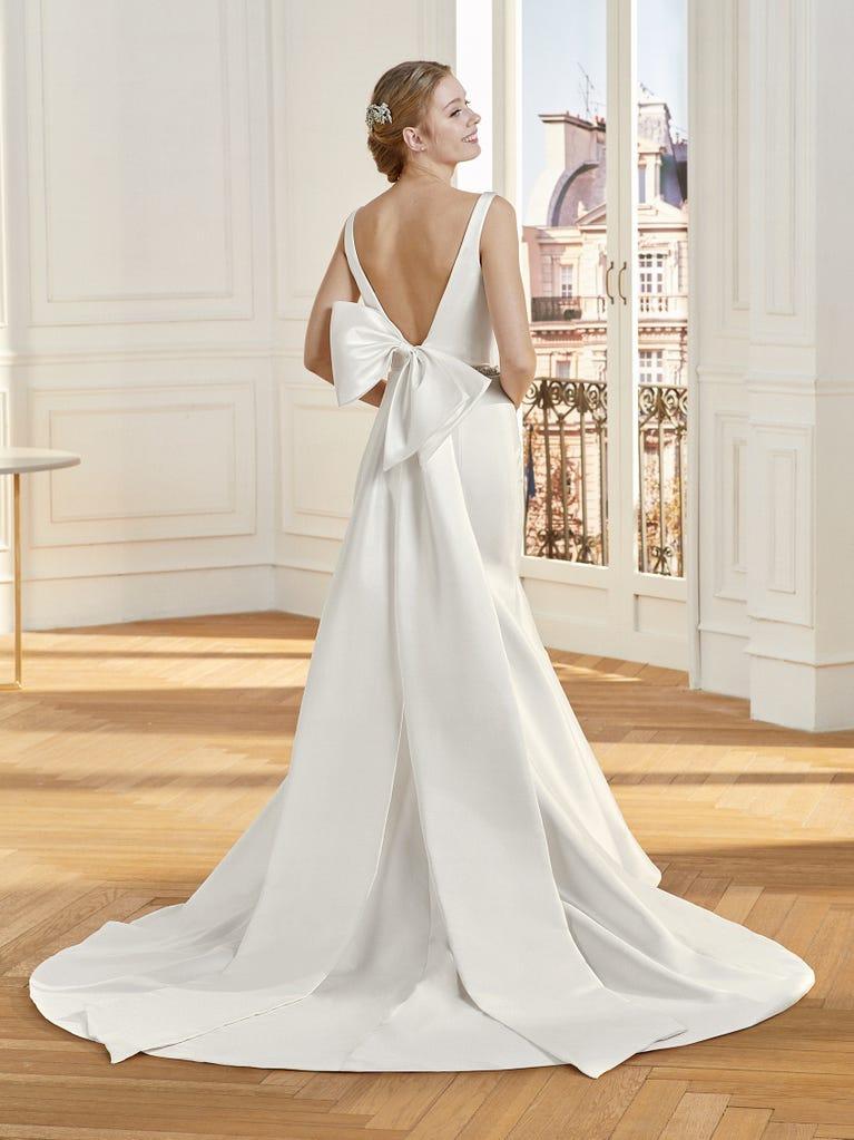 Stunning low-back wedding dress, ties in back, with full skirt by