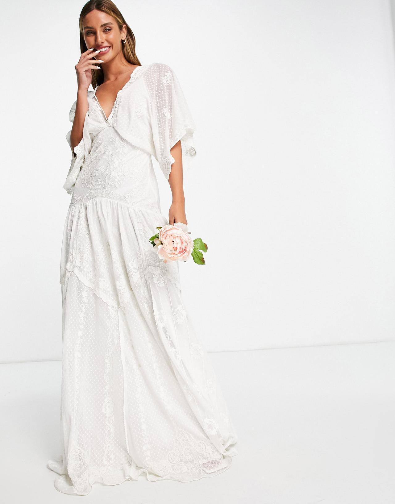 Model wearing a boho lace wedding dress